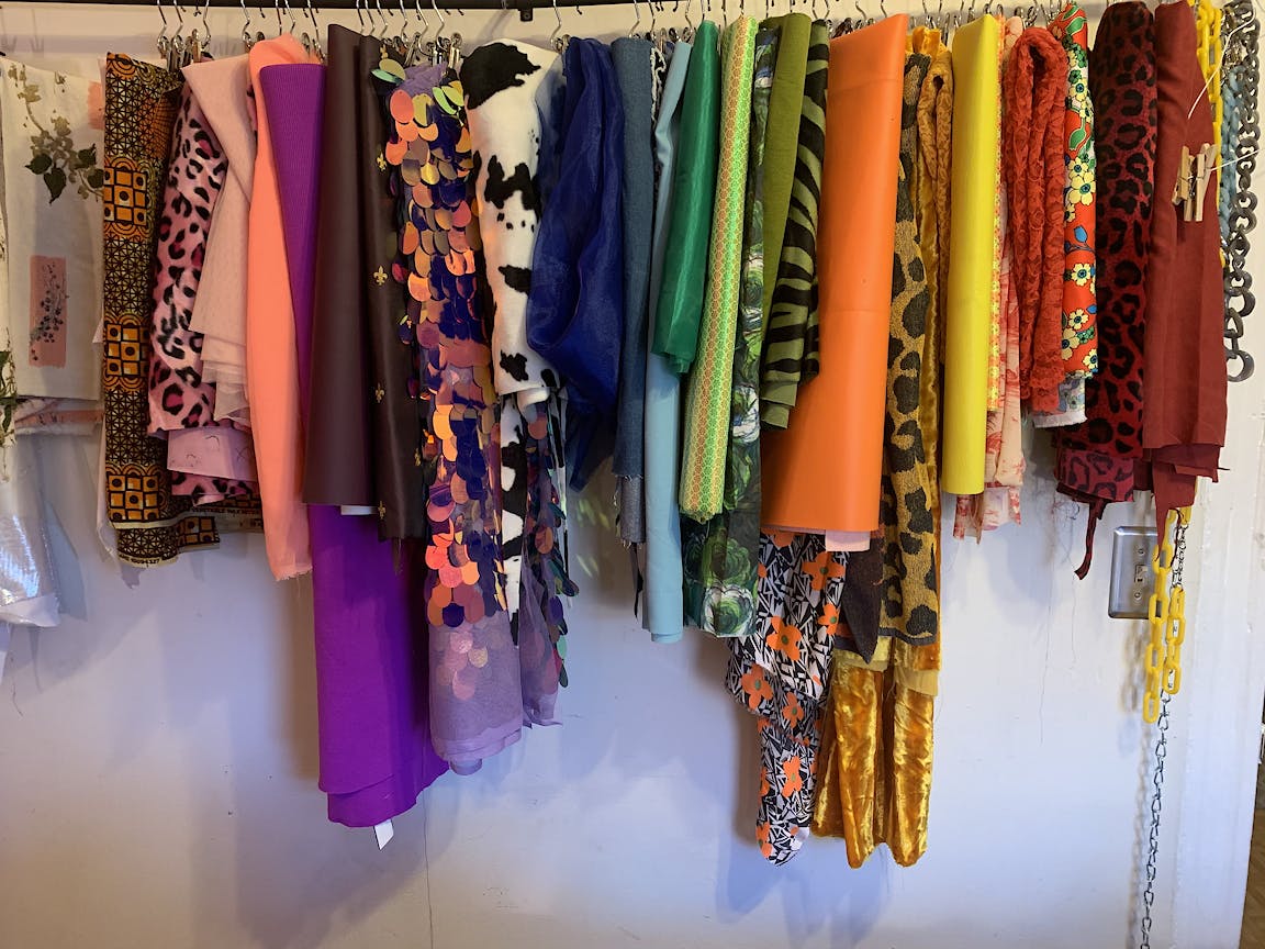 A rack full of colorful and patterned fabrics.